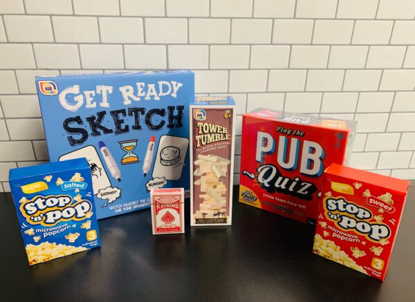 A variety of Walter Geering's Games Night Welcome Packs, Pack1 on a table for Games Night.