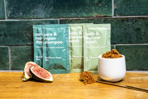 Walter Geering Fig and Brown Sugar Collection featuring eco-friendly toiletries in sleek, recyclable packaging with rich fig and brown sugar aromas.
